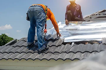 A worker installing roof